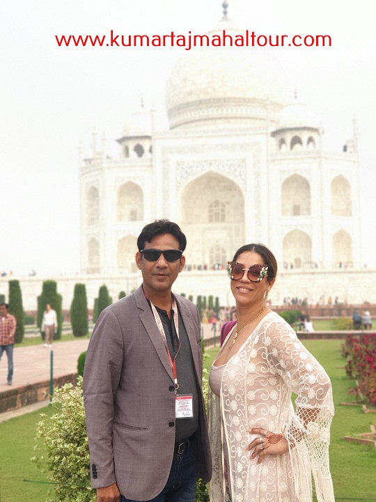 Posing in front of Taj Mahal with the Tour Guide